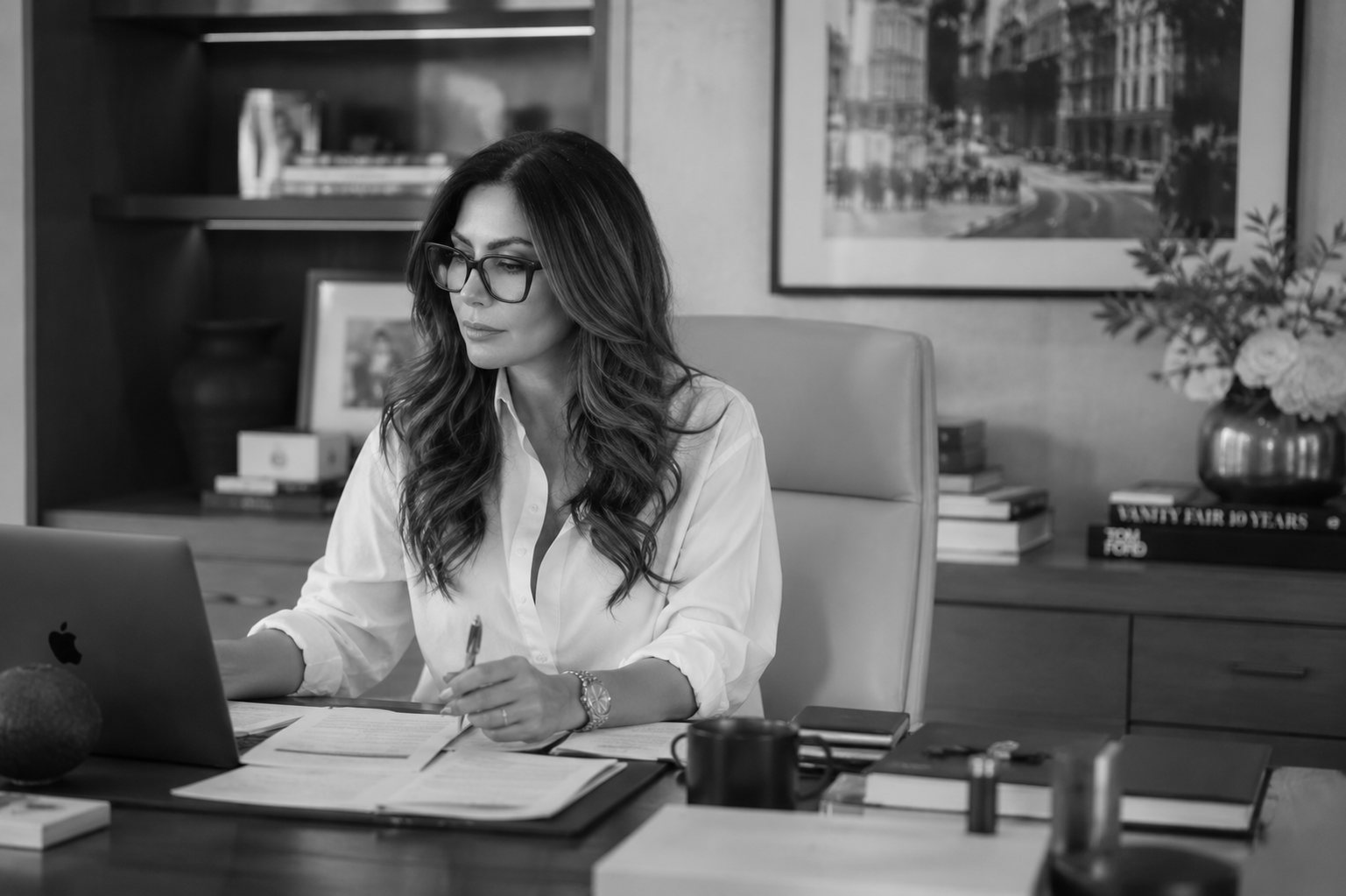 Cathy Nehme reviewing a dental practice transaction file